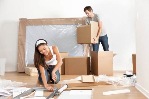 Removal team preparing house removals in Richmond with packed boxes