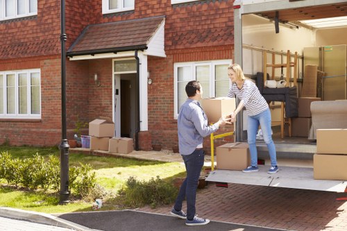 Man with van loading furniture in Richmond street