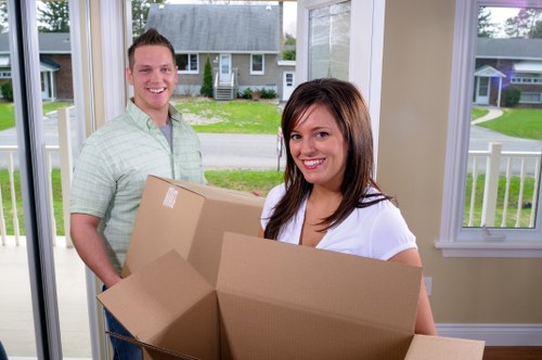 Furniture pick-up service removing a sofa in Richmond