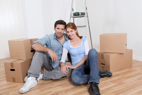 Loader carrying furniture from a Richmond home for a free quote scenario